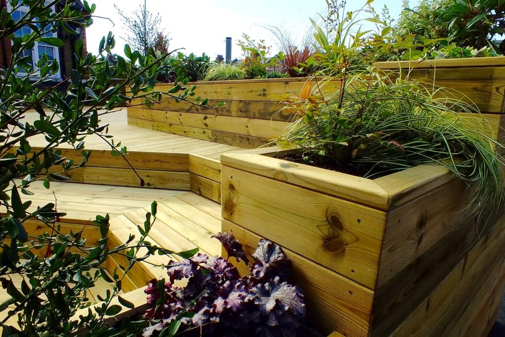 Code III treated redwood decking and planters used at Telferscot School in London